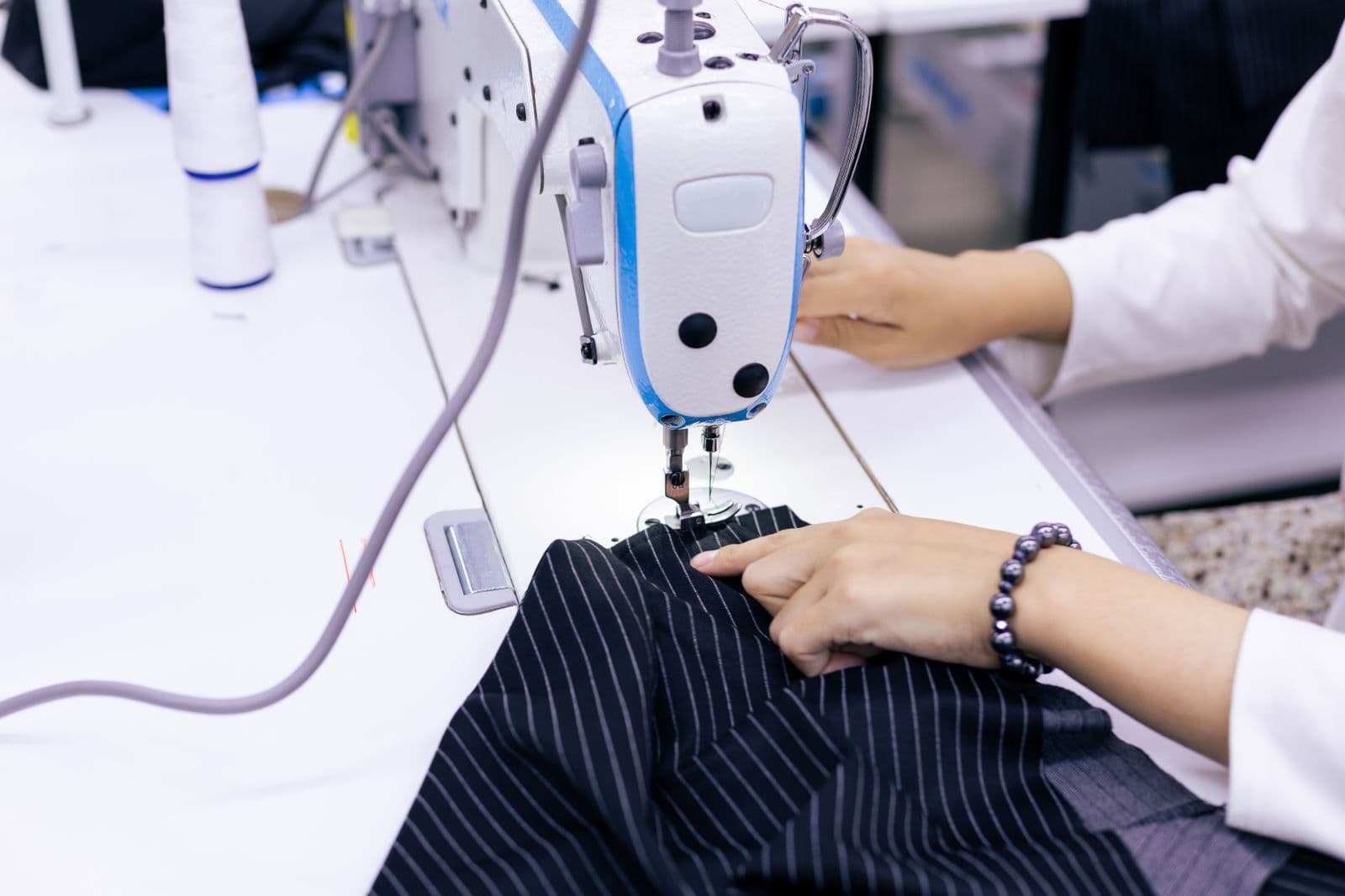 Garment worker using an industrial sewing machine